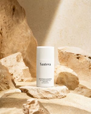 A bottle of organic serum demonstrating the role of glutathione in sun protection, showing how to prevent sun spots naturally by neutralizing free radicals alongside a broad-spectrum SPF.